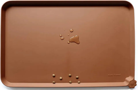 Caramel brown durable silicone pet feeding mat with raised borders and kibble.