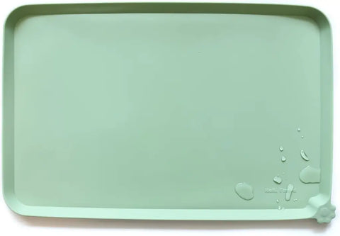 Jade green premium silicone pet feeding mat with raised splash-proof border by Hoki Found.
