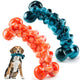 Two bone-shaped indestructible dog chew toys in blue and orange for aggressive chewers.