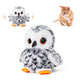 Interactive flapping owl plush cat toy sitting next to an orange tabby kitten watching it move