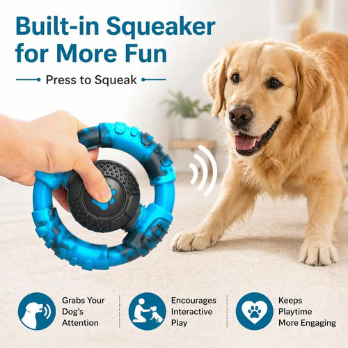 Customer review image showing a hand pressing the squeaker center of the blue ring toy to grab the attention of an excited Golden Retriever.