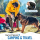 Man camping and traveling with a German Shepherd using a fold-cap dog water bottle