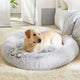 Golden Retriever resting inside a spacious light grey calming donut dog bed