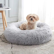 Light grey faux fur anti-anxiety donut cuddler bed with PVC anti-slip base for small dogs and cats