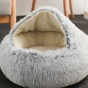 Close-up of a light grey pet bed with a soft, plush white interior for cozy texture