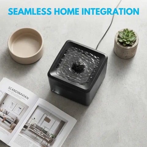Top-down view of a minimalist black smart pet fountain integrated seamlessly into modern home decor.
