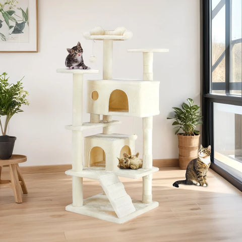 Modern Beige plush cat tree tower positioned next to a living room window with playing kittens and adult cats.