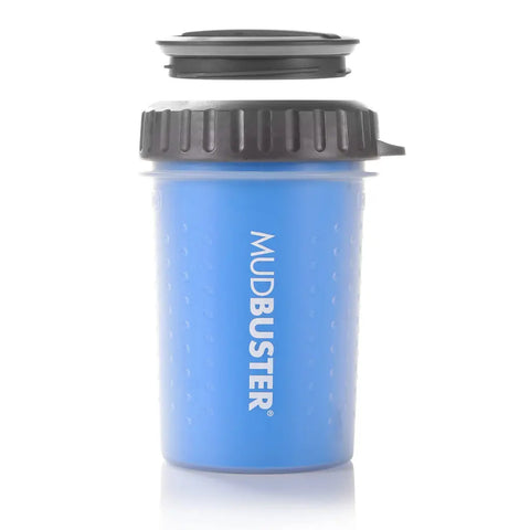 Pro blue MudBuster dog paw cleaner cup with its travel lid detached and floating above
