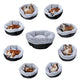 Multiple pet beds with dogs inside on a white background.