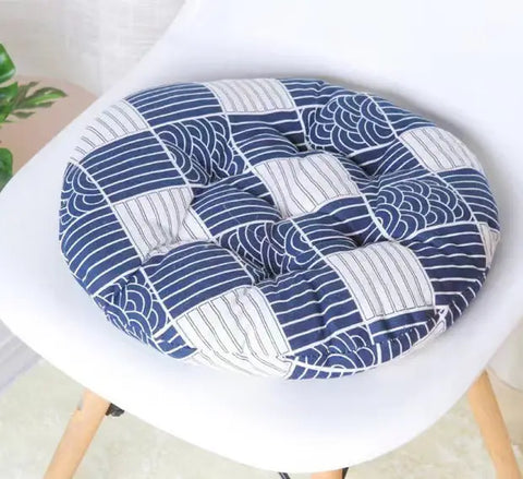 Natural woven cat bed with rope handles and soft cushion.
