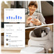 Smartphone screen displaying the Neakasa app tracking pet health metrics, cat weight data, and toilet usage frequency alongside a cat sitting in the litter box.