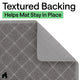 Close-up of grey cat litter mat showing its non-slip textured backing folded up at the corner