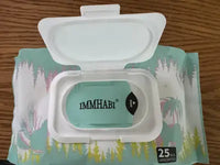 An open white plastic flip-top lid on an Immhabi pet wipes pack, showing the inner protective sticker seal from a customer perspective.