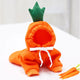 Orange carrot-shaped pet costume with green top on a white background