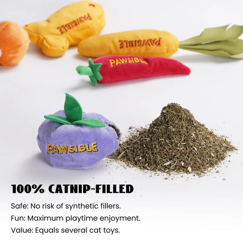 A purple plush blueberry toy next to a pile of pure organic catnip, with a red chili pepper, yellow carrot, and fish cat toy in the background.
