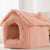 Pawvortex pink pet house with fluffy textured exterior and plush interior on light background, featuring a cozy, washable retreat with thermal comfort for cats and small dogs in US homes.