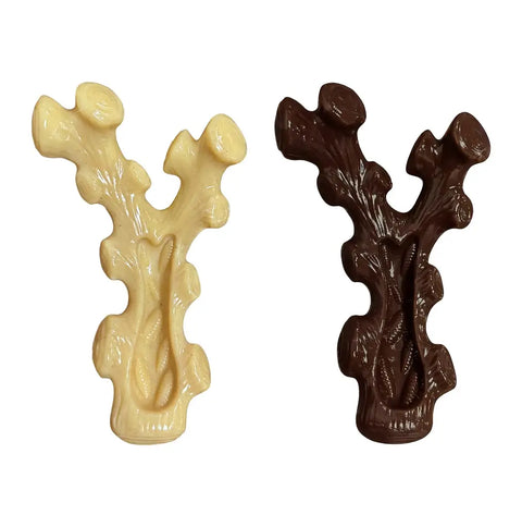 Front grooved view of the cream and chocolate-colored dog chew toys designed for spreading peanut butter.