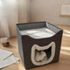 Pet bed with a cat inside on wooden floor with cup and papers.