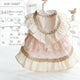Pet dress with lace details on a white background.