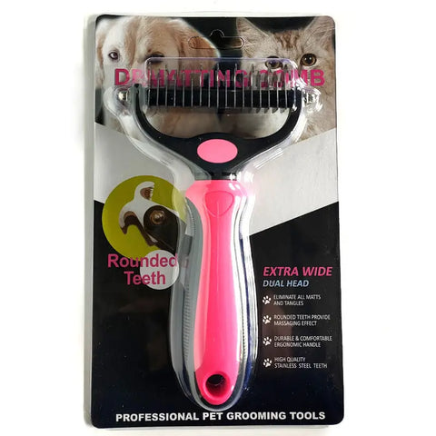 Pet grooming comb with pink handle on packaging with dog and cat.