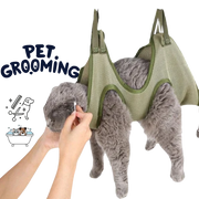 Pet grooming hammock with a gray cat inside, held by a hand, on a white background