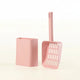 Pink cat litter scoop and its container on white background.
