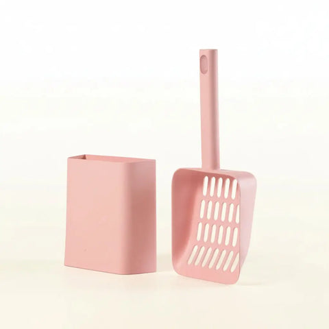 Pink cat litter scoop and its container on white background.