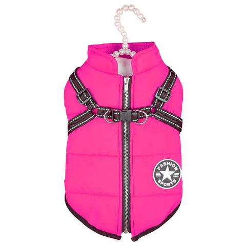 Pink dog vest with a black harness on white background.