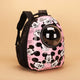 Pink pet backpack with cartoon character design on a beige background