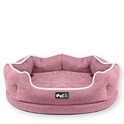 Pink pet bed with white trim on a white background on PawVortex