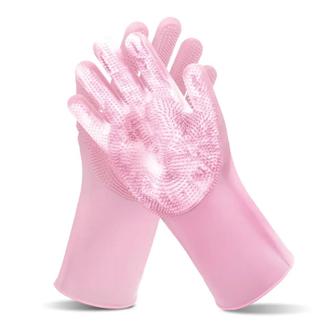 Pink silicone pet scrubbing and grooming gloves for dog bathing.