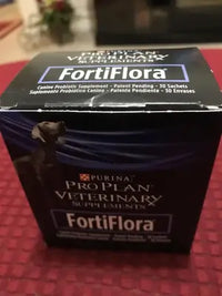 Close-up view of a box of Purina Pro Plan Veterinary Supplements FortiFlora canine probiotic formula for dogs.