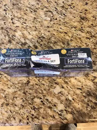 A three-pack retail bundle of Purina Pro Plan Veterinary Diets FortiFlora canine probiotic supplement boxes wrapped in plastic.