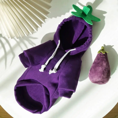Purple hoodie with a green stem on a white surface.