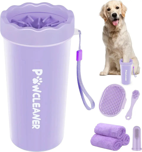 Purple silicone dog paw washer cup set with matching brush and towels next to a Golden Retriever.