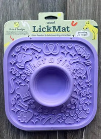 Customer image showing the unboxed purple Woof LickMat 2-in-1 slow feeder in its original packaging.