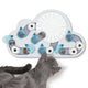 Grey cat interacting with a rainy day cloud-shaped treat puzzle featuring blue raindrops and a white sun.