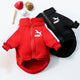 Red and black Puma pet jackets with sports equipment on white.