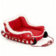 Red and white sled with decorative elements on white background.