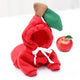 Red apple-shaped costume with green leaf and brown stem on white.