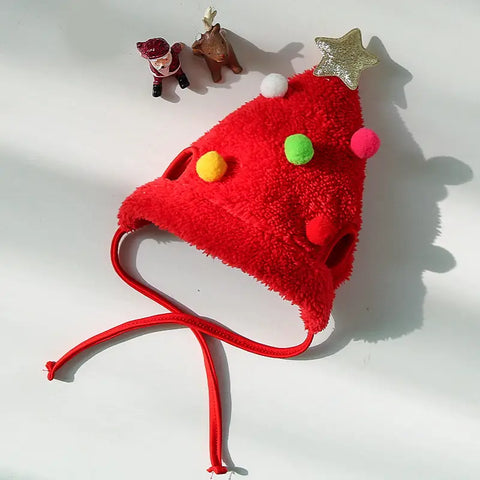 Red fuzzy Santa hat with colorful pom-poms and a star.