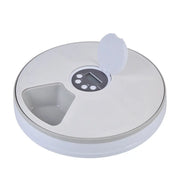 Round electronic device with digital display on a white background