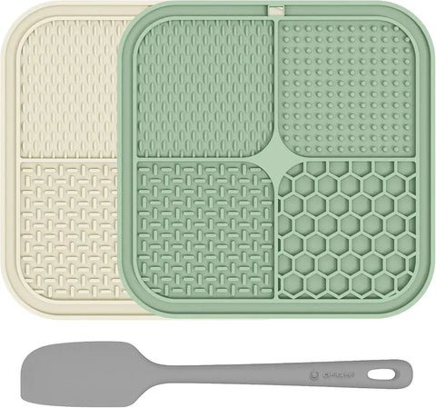 Mint green and beige textured silicone pet licking mats with a grey food spatula.