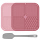 Two shades of pink textured silicone pet licking mats shown with a grey food spatula.