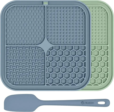Slow feeder dog lick pad 2-pack in slate blue and mint green with an included food spatula.
