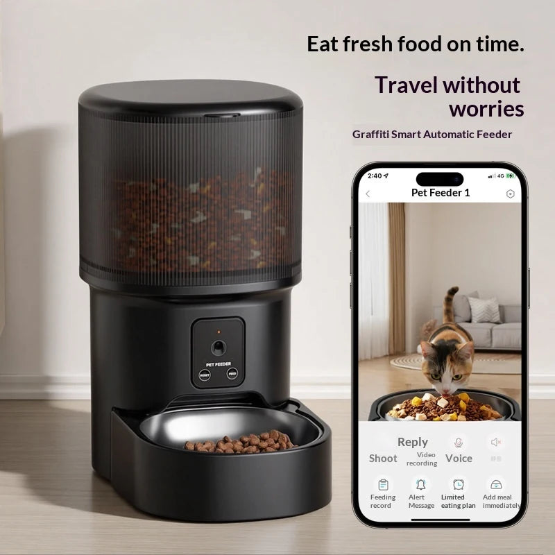 Black smart automatic pet feeder paired with a smartphone app interface showing a live video feed of a cat eating