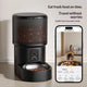Black smart automatic pet feeder paired with a smartphone app interface showing a live video feed of a cat eating.