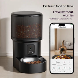 Black smart automatic pet feeder paired with a smartphone app interface showing a live video feed of a cat eating.