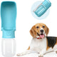 Lake blue 12 oz fold-out dog water bottle dispenser next to a happy Beagle