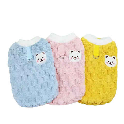 Three colorful pet sweaters with bear face designs on white background.